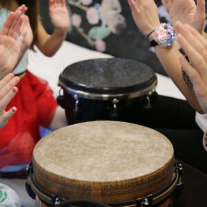 hands drumming on drums