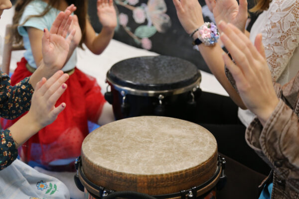 hands drumming on drums