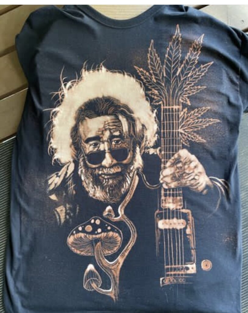 t-shirt design with a man holding a guitar