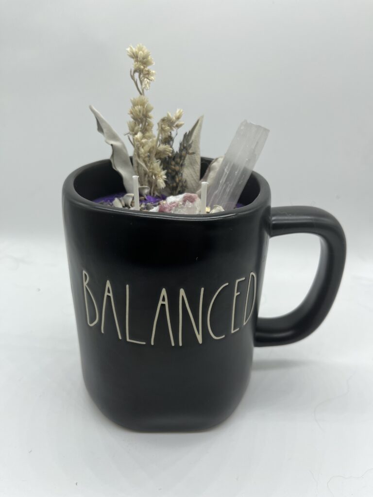 a mug full of herbs and crystals