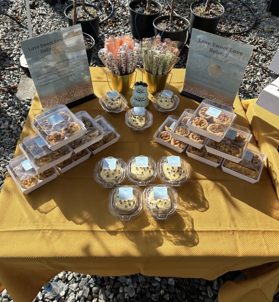 a baked goods vendor table setup