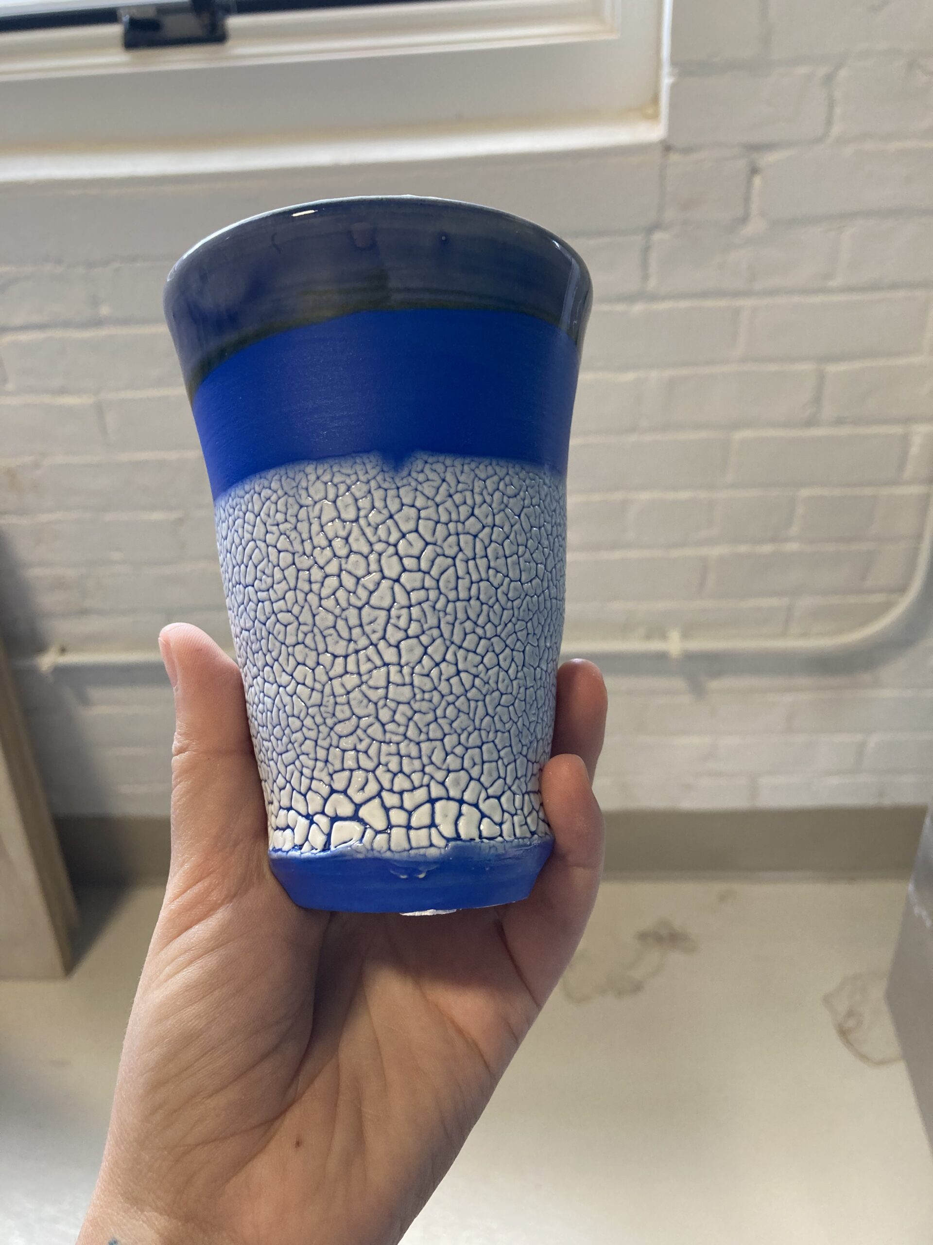 a blue ceramic cup