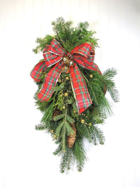 a Christmas wreath with a bowtie on it