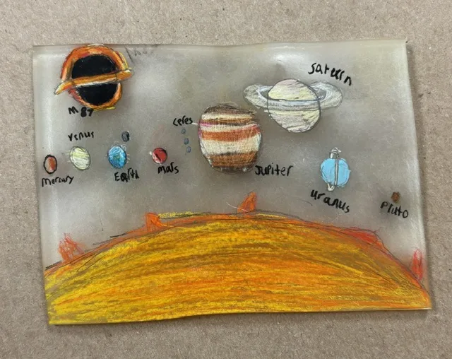 Shrink art solar system made by a teen at Kent Library