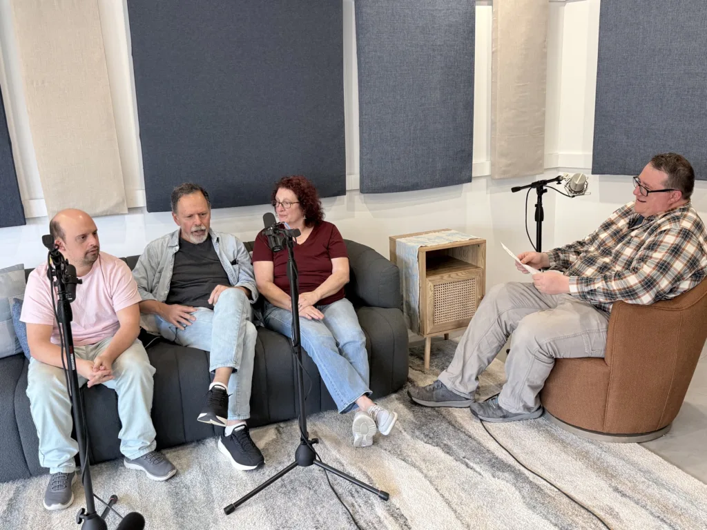 Host Jon Harrison interviewing Brandon and his parents Mike and Cathy in the StoryWoven recording studio.